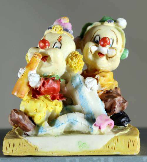 Small clown figurine babies playing