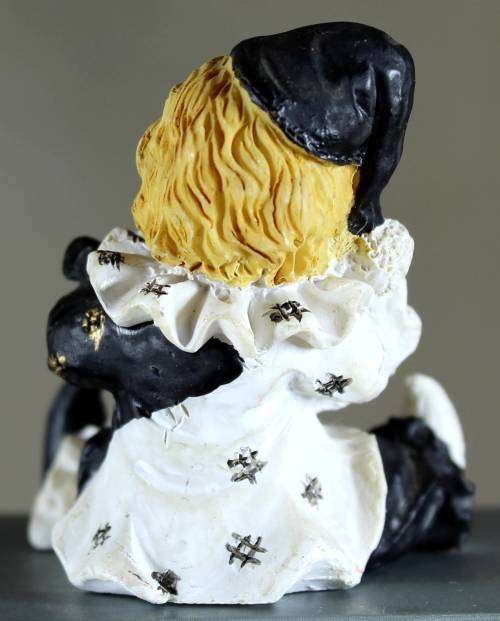 Small clown figurine Pierrot with piggy