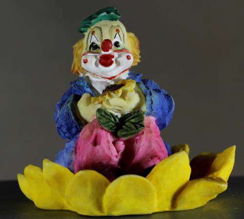 Small Clown Figurine - Seated in Large Sunflower - BID NOW