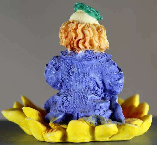 Small Clown Figurine - Seated in Large Sunflower - BID NOW