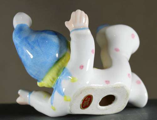 Small Clown Figurine - Boy Laying on His Back - BID NOW