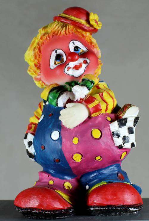Clown Figurine - With Yellow Hair and Multi Colored Clothing - BID NOW