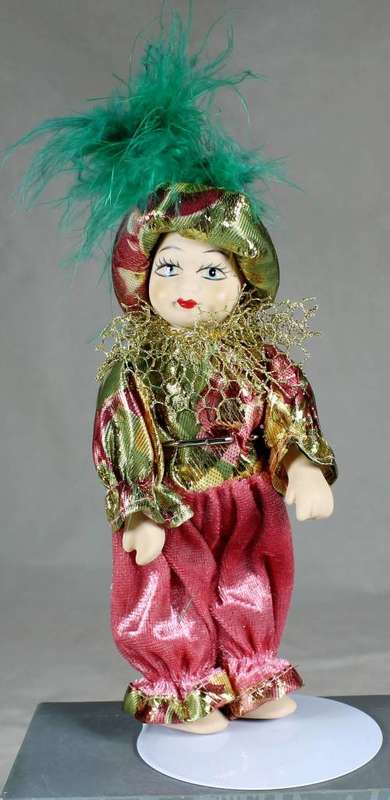 Doll in traditional clothes on stand