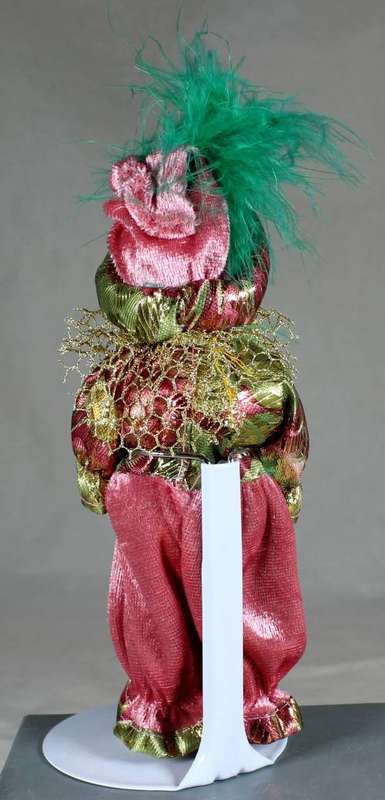 Doll in traditional clothes on stand