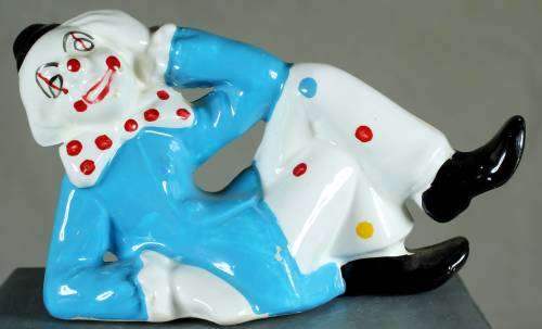 Clown figurine reclining with smile