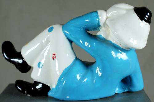 Clown figurine reclining with smile