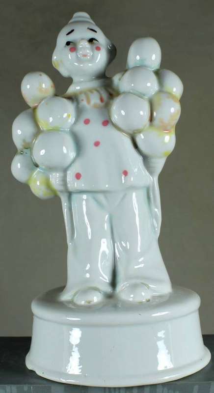 Clown figurine with large cluster of balloons