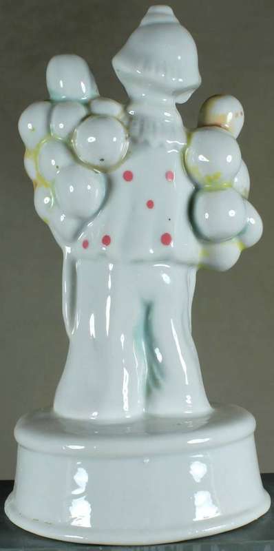 Clown figurine with large cluster of balloons