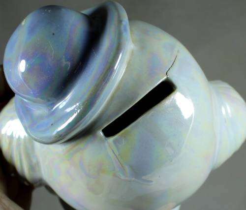 Clown figurine piggy bank with bow-tie