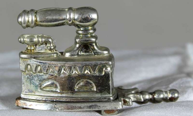 Miniature metal iron on stand
