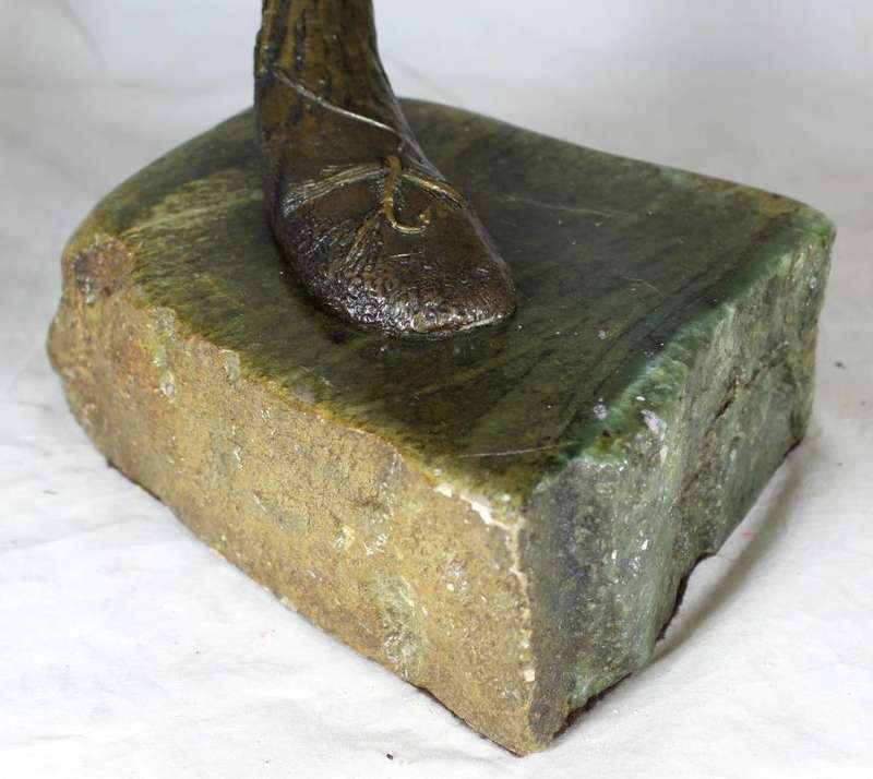 Molded fish sculpture on carved rock