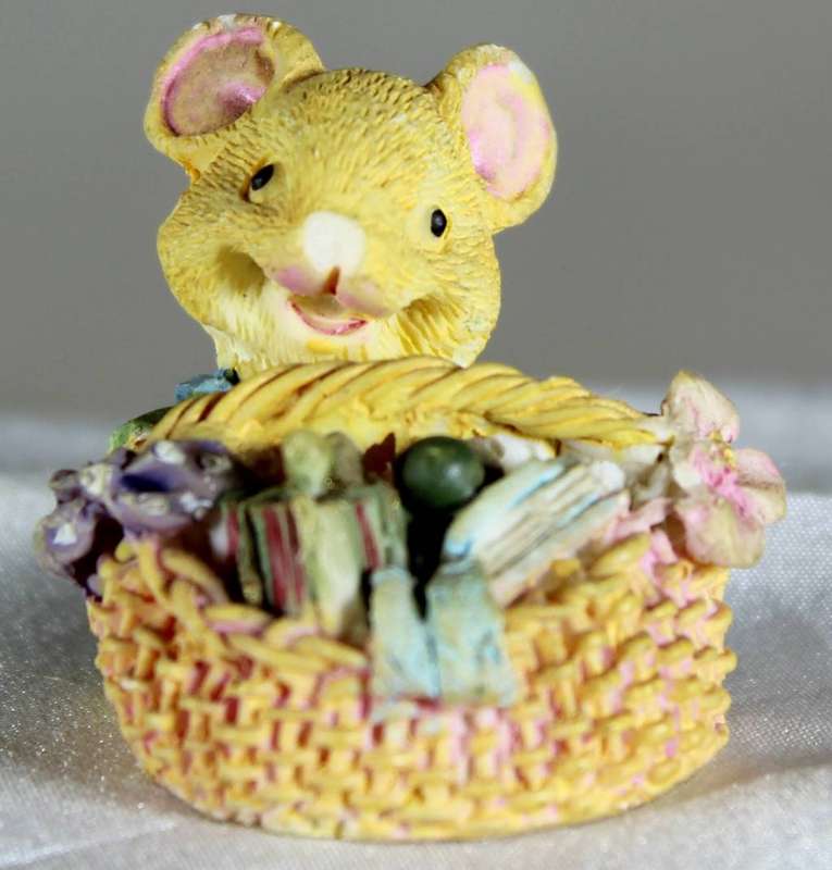 Miniature mouse in a basket
