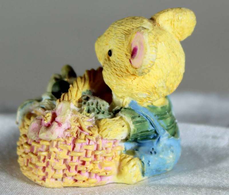 Miniature mouse in a basket
