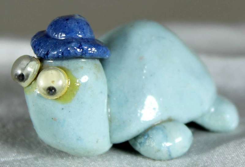 Miniature tortoise with hat