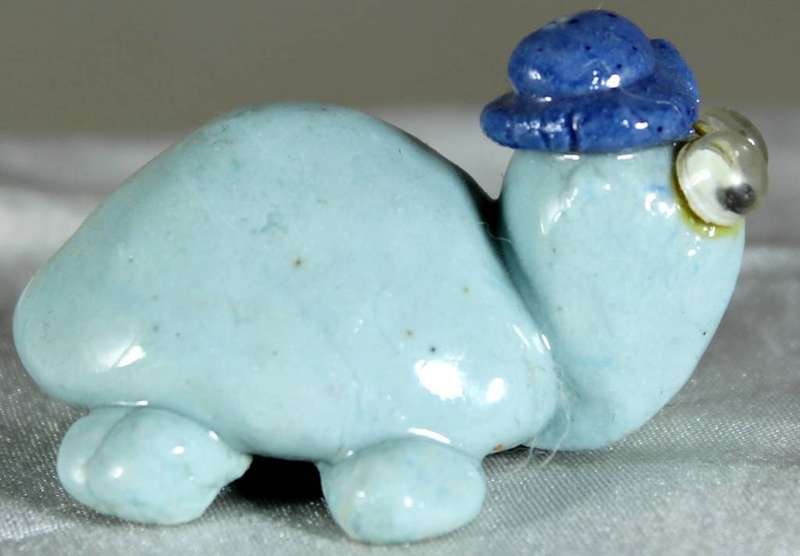 Miniature tortoise with hat