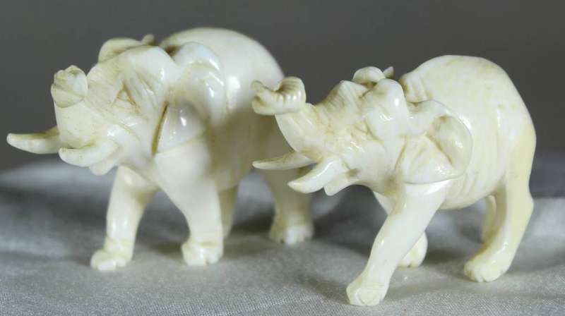 Miniature pair of molded elephants