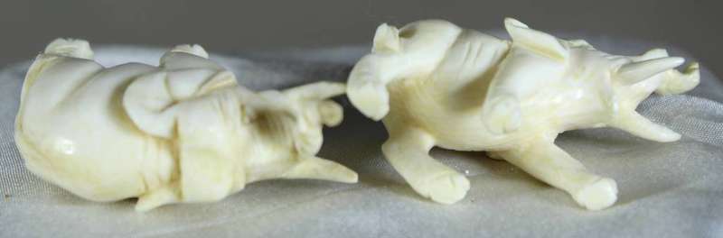 Miniature pair of molded elephants