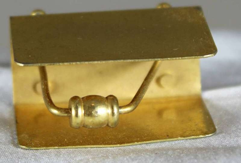 Miniature brass magazine rack