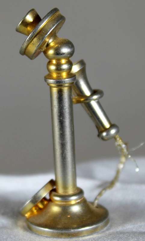 Miniature brass telephone