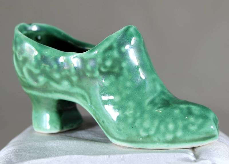 Green high heel porcelain shoe