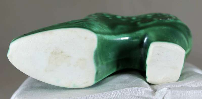 Green high heel porcelain shoe