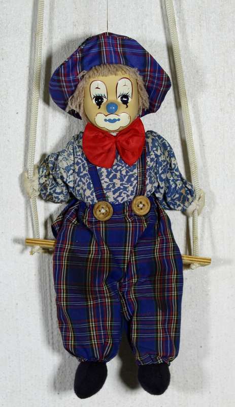 Clown With Red Bow-Tie on Swing