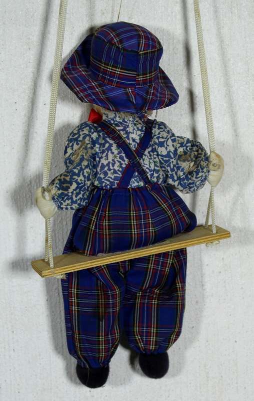 Clown With Red Bow-Tie on Swing