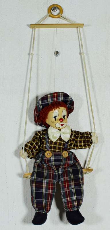 Clown With Cream Bow-Tie on Swing