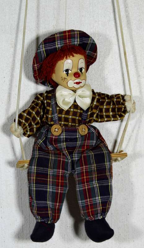Clown With Cream Bow-Tie on Swing