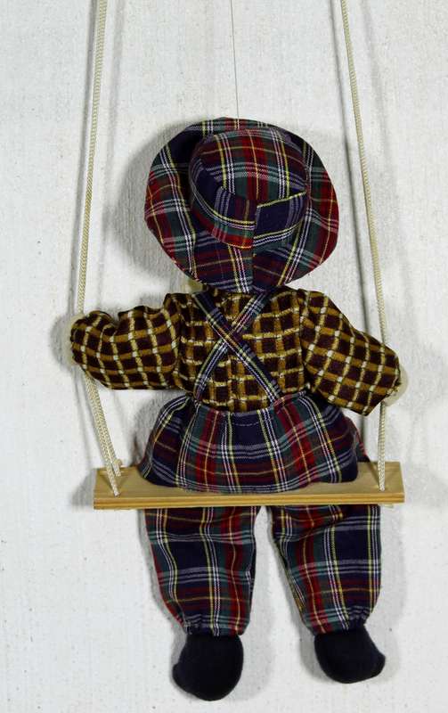 Clown With Cream Bow-Tie on Swing