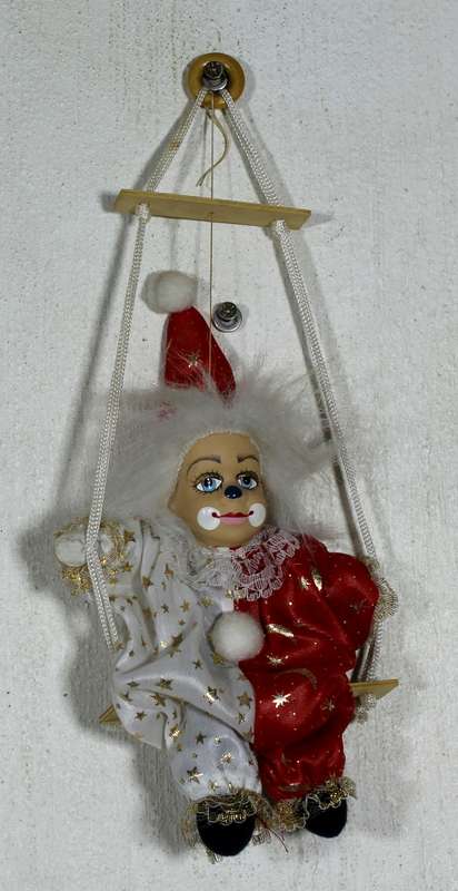 Clown in Red & White on Swing
