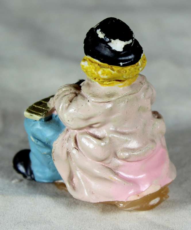 Sitting clown playing musical instrument