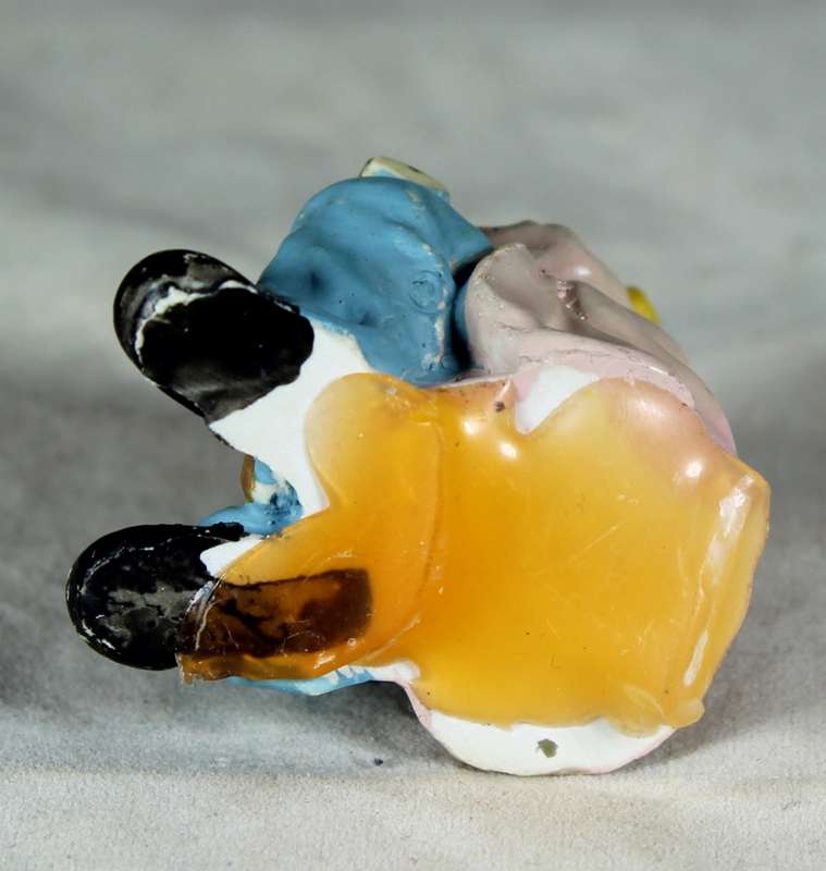 Sitting clown playing musical instrument