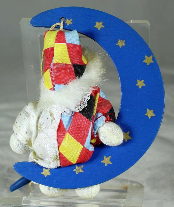 Hanging clown sitting in moon