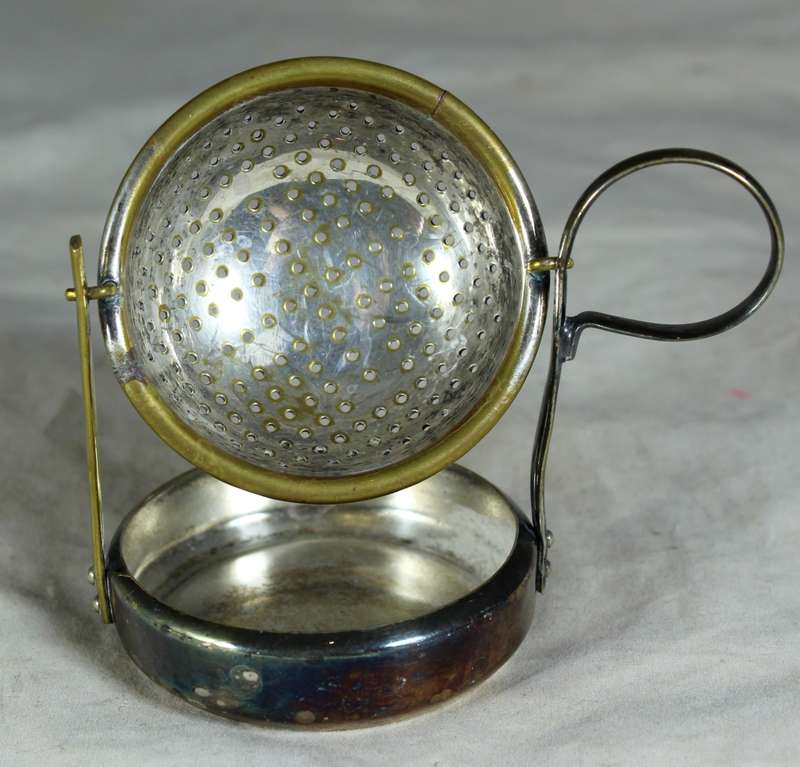 Vintage silver plated English tea strainer with swivel & drip tray
