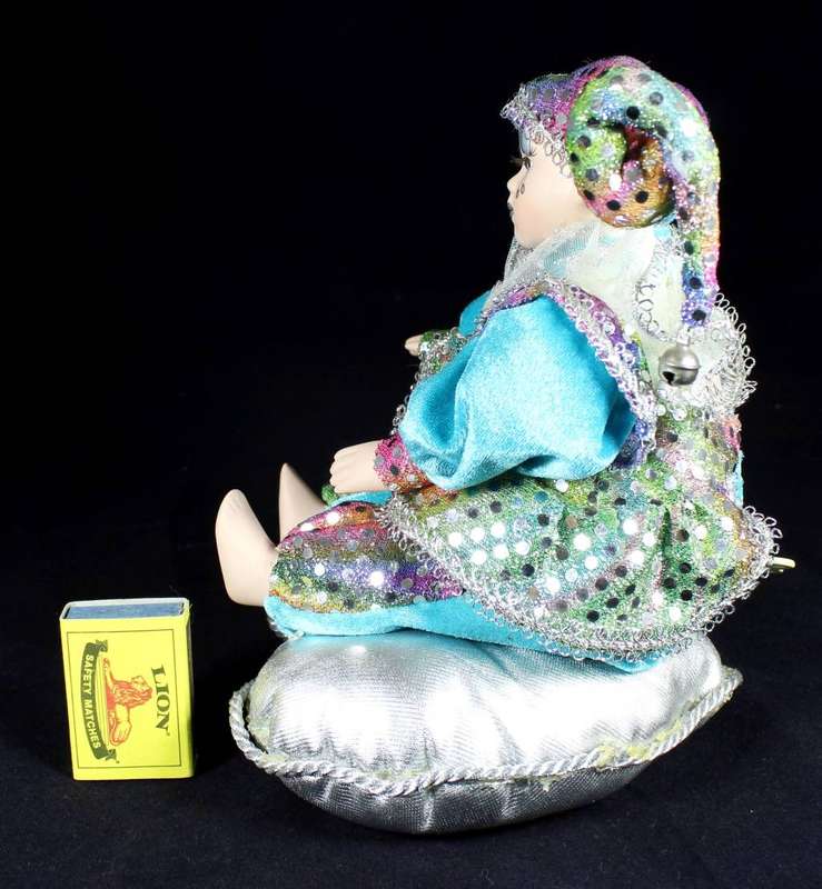 Wind-up gypsy girl on cushion