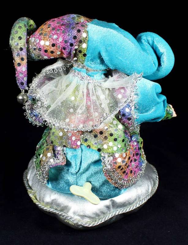 Wind-up gypsy girl on cushion
