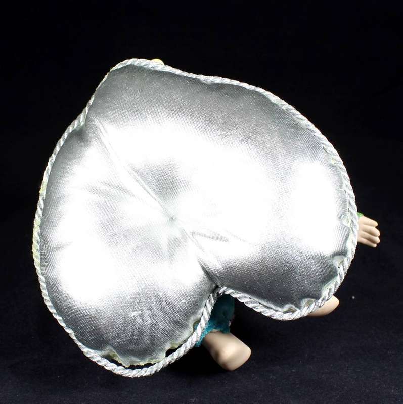 Wind-up gypsy girl on cushion