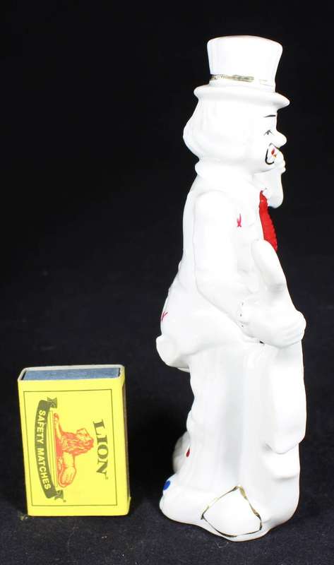 Porcelain clown with double bass