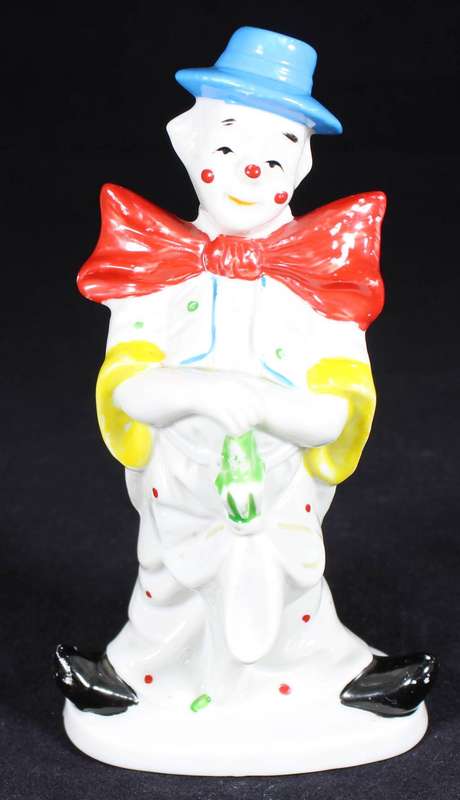 Porcelain clown with umbrella