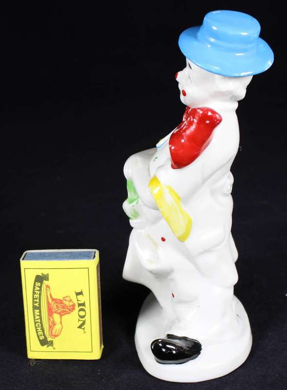 Porcelain clown with umbrella