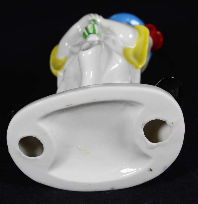 Porcelain clown with umbrella