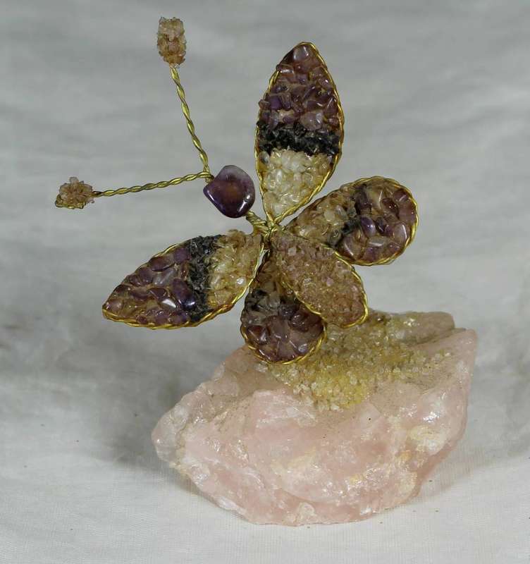 Precious stone butterfly on rock