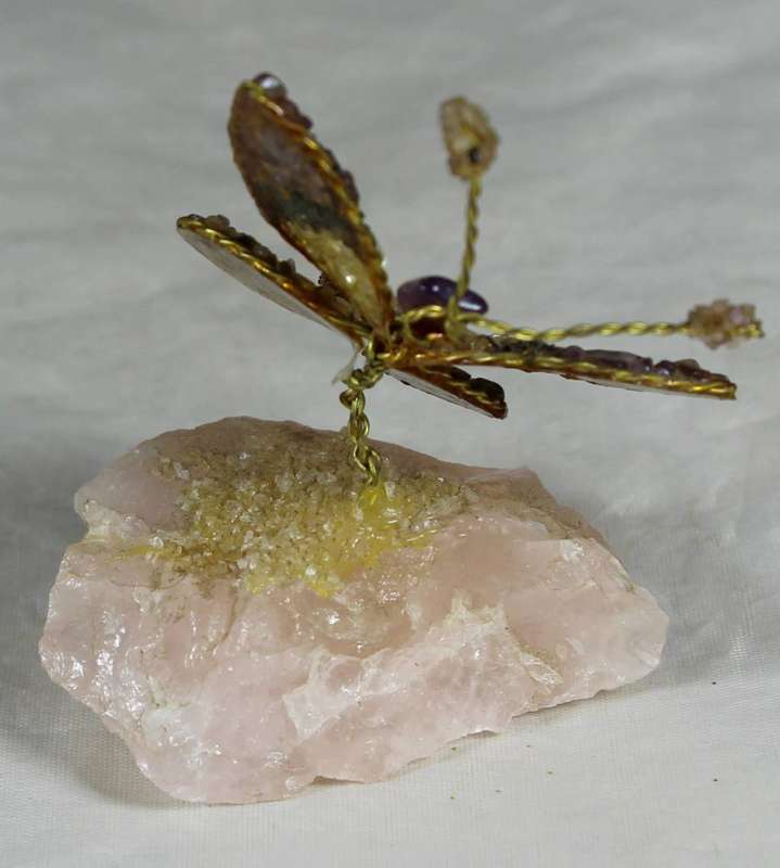 Precious stone butterfly on rock