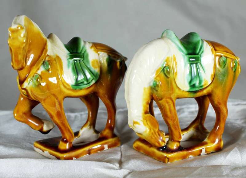 Pair of Chinese style horses with satchel