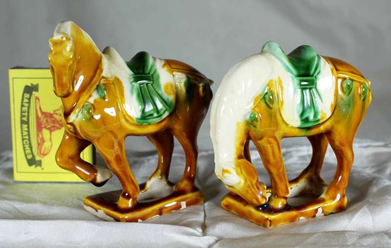 Pair of Chinese style horses with satchel