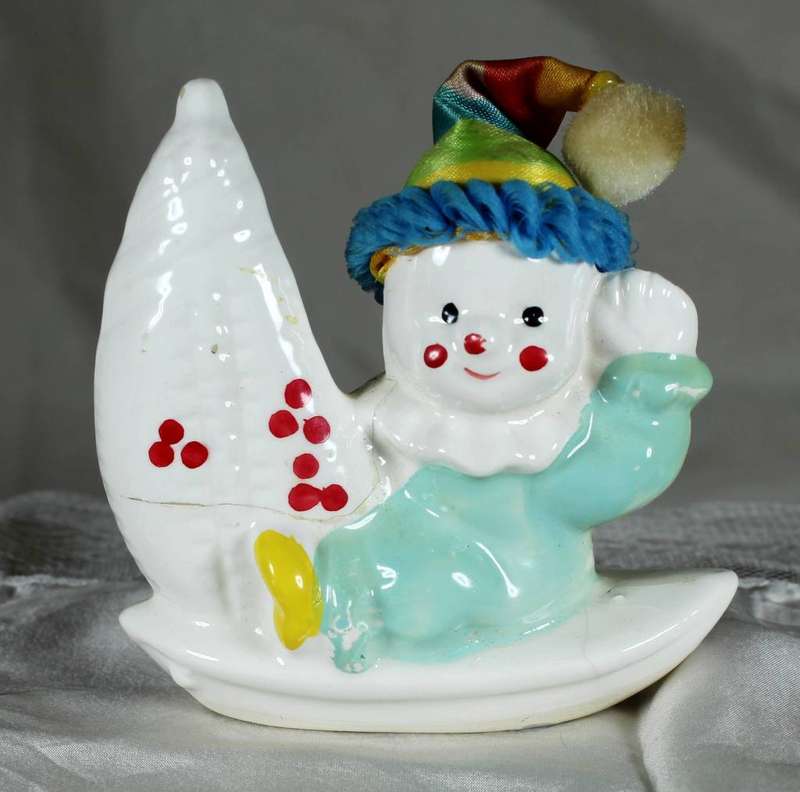 Baby clown on sailboat