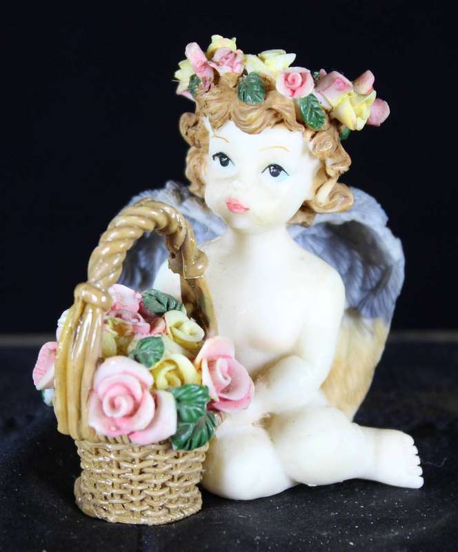 Cherub with flower crown & basket of roses