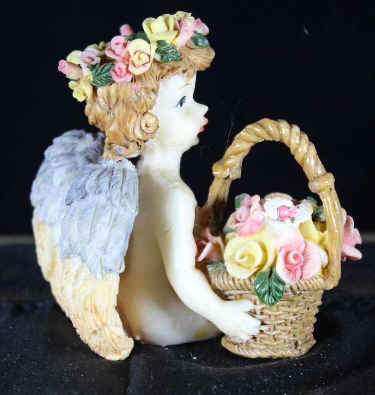 Cherub with flower crown & basket of roses