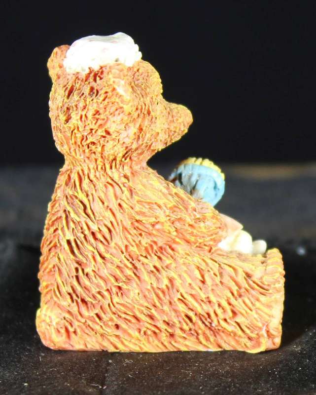 Sitting bear with doll